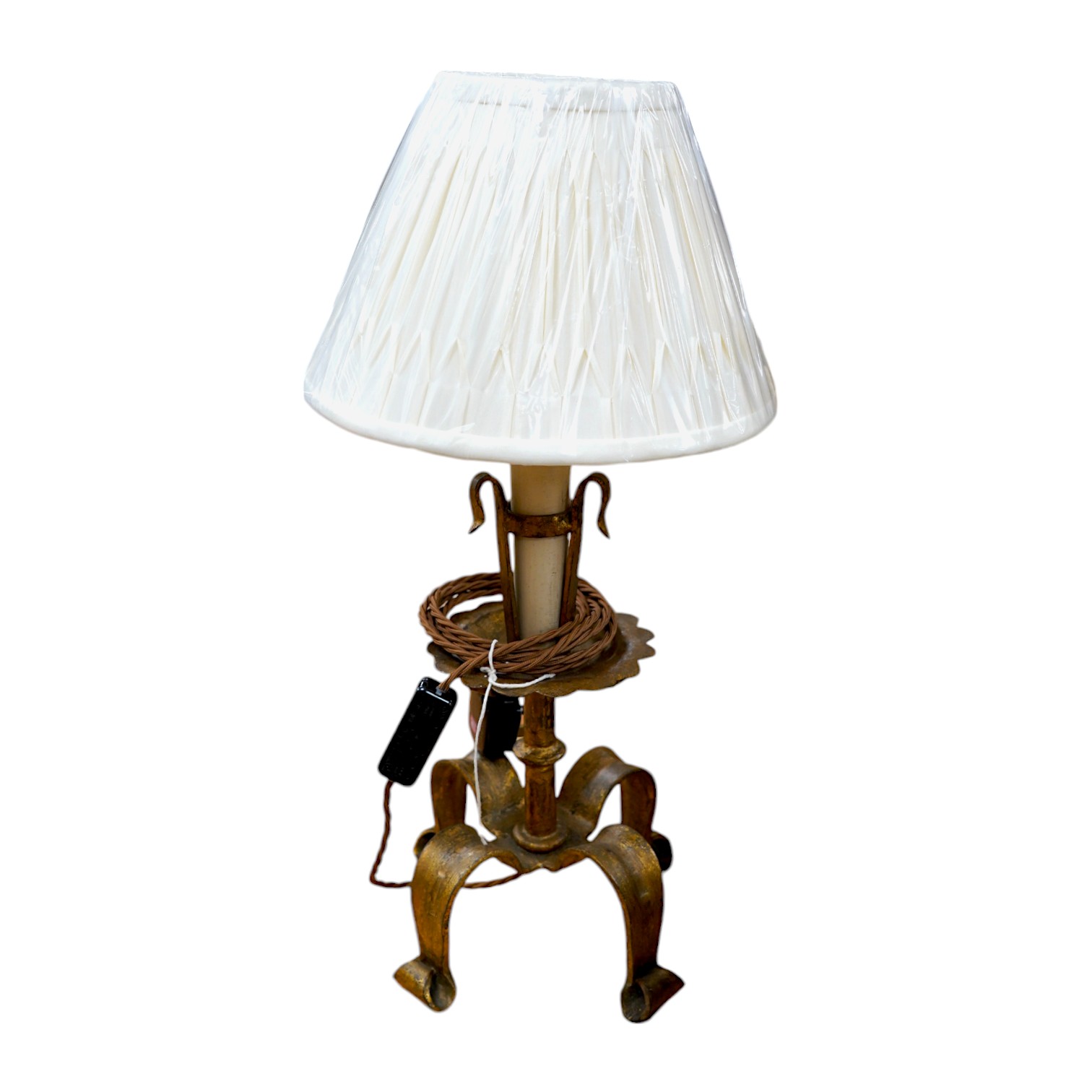 A Spanish single gilded wrought iron table lamp with fabric shade, wired, 51cm to top of shade. Condition - good.